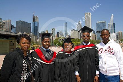 Multi ethnic college graduates celebrate the occasion in Grant Park, Chicago, Illinois, USA.