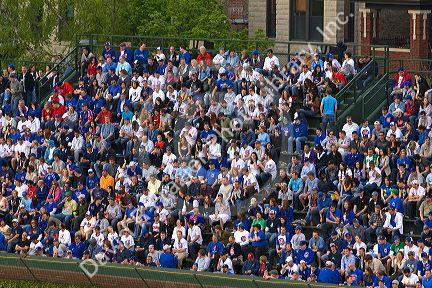 Fans in bleachers watch a Cubs baseball game at Wrigley Field in Chicago, Illinois, USA.