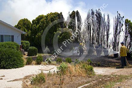 Firefighters mop up a residential fire in Canyon County, Idaho, USA.