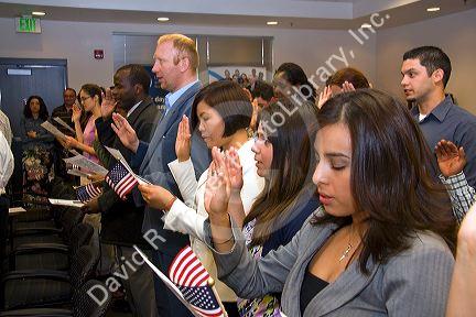 New United States citizens raise their right hand for citizenship oath ceremony in Idaho, USA.