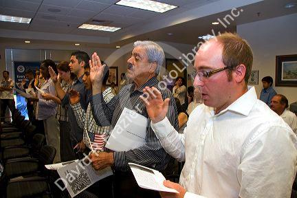 New United States citizens raise their right hand for citizenship oath ceremony in Idaho, USA.