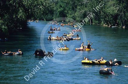 People float down the Boise River on inner tubes and rafts in Boise, Idaho.