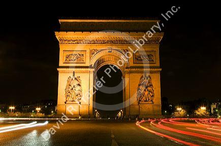 Arc de Triomphe lit at night stands in the centre of the Place Charles de Gaulle, Paris, France.