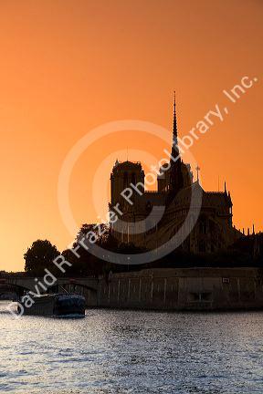 Nortre Dame cathedral and the River Seine at sunset in Paris, France.