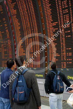 Departure board located in the Paris-Charles de Gaulle Airport, Paris, France.