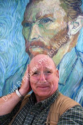 David R. Frazier stands in front of a Van Gogh self portrait outside of the Musee d'Orsay in Paris, France. MR
