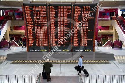 Departure board located in the Paris-Charles de Gaulle Airport, Paris, France.