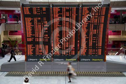Departure board located in the Paris-Charles de Gaulle Airport, Paris, France.
