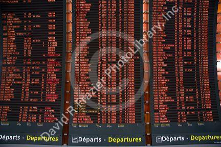 Departure board located in the Paris-Charles de Gaulle Airport, Paris, France.