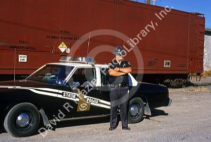 Idaho State Police officer guards a train carrying nuclear waste before returning it to Colorado.