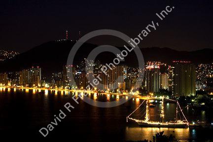 Night view of the Acapulco Bay and skyline, Acapulco, Guerrero, Mexico.