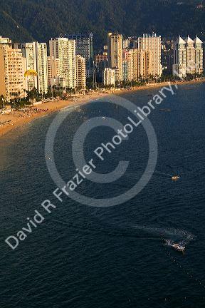 Acapulco Bay lined with hotels in Acapulco, Guerrero, Mexico.
