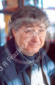 Adult male with reading glasses.