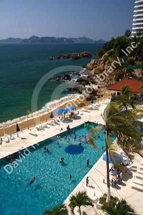 Hotel swimming pool along the bay in Acapulco, Guerrero, Mexico.