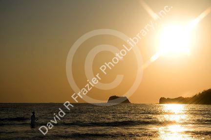 Sunset fishing in the Pacific ocean at Playa Carrillo near Samara, Costa Rica.