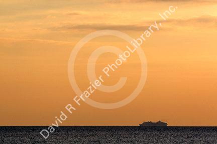 Cruise ship in the pacific ocean at sunset off the coast of Jaco, Costa Rica.