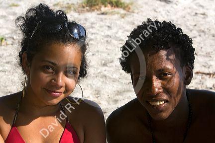 Native latin and afro-carribean multi-ethnic couple on the beach near Samara, Costa Rica.