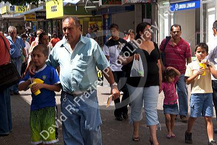 Pedestrians on a walking street in San Jose, Costa Rica.