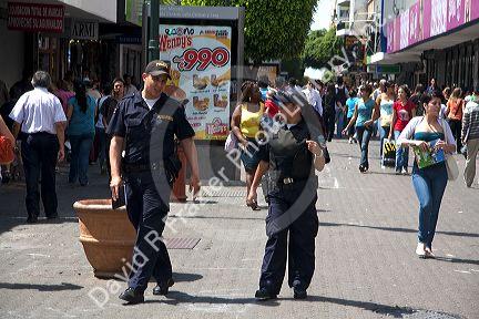 Police on a walking street in San Jose, Costa Rica.
