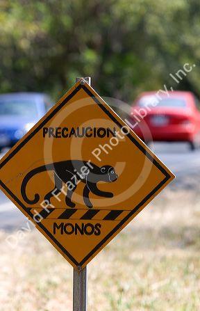 Road sign on the Pan American Highway cautions monkey crossing in Costa Rica.
