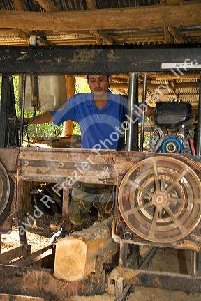 Worker using a sawmill near Samara, Costa Rica.