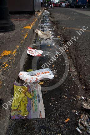 Trash lines the gutter of a street in San Jose, Costa Rica.