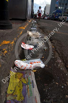 Trash lines the gutter of a street in San Jose, Costa Rica.