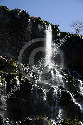 Natural spring water flowing out of lava rock at the Thousand Springs area of the Snake River in the Hagerman Valley, Idaho, USA.