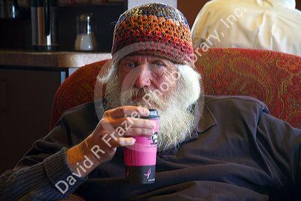Elderly man in a coffee shop in Boise, Idaho, USA. MR