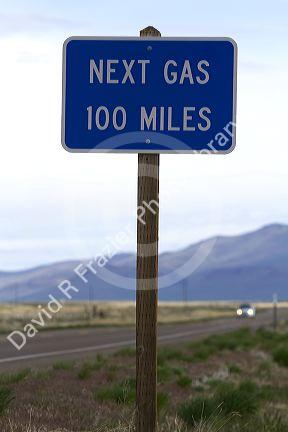 Next gas 100 miles road sign at the Oregon/Nevada border in McDermitt, USA.