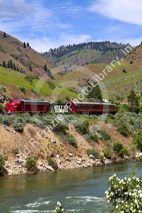 The Thunder Mountain Line scenic tourist train traveling along the Payette River between Horseshoe Bend and Banks, Idaho, USA.