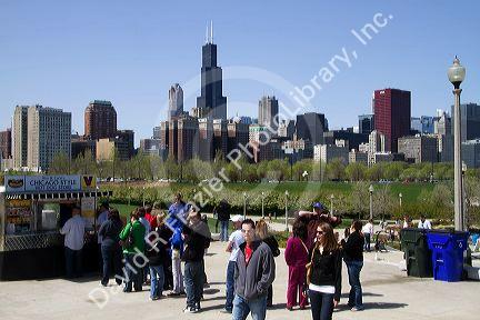 Hot dog vendor with Willis Tower in the background at Shedd Aquarium in Chicago, Illinois, USA.