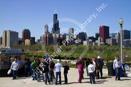 Hot dog vendor with Willis Tower in the background at Shedd Aquarium in Chicago, Illinois, USA.