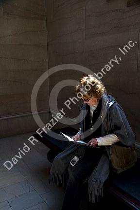 Female tourist at the Art Institute of Chicago, Illinois, USA. MR