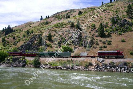 The Thunder Mountain Line scenic tourist train traveling along the Payette River between Horseshoe Bend and Banks, Idaho, USA.