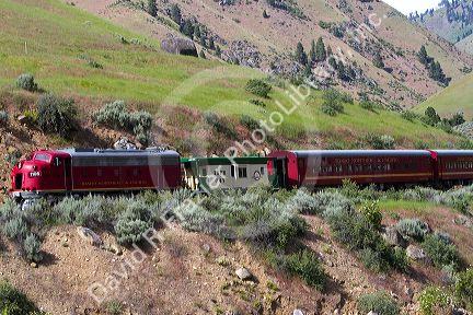 The Thunder Mountain Line scenic tourist train traveling along the Payette River between Horseshoe Bend and Banks, Idaho, USA.