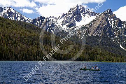 Canoeing on Stanley Lake in the Sawtooth Mountain Range near Stanley, Idaho, USA.