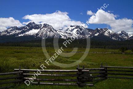 Split rail fencing runs through a meadow near Stanley, Idaho, USA.