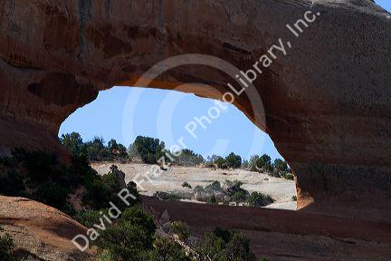 Wilson Arch is a natural sandstone arch along U.S. Route 191 near Moab, Utah, USA.