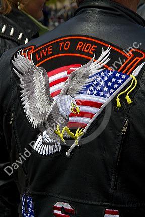 Patriotic patch on the back of a leather jacket at a motorcycle rally to create driver safety awareness in Boise, Idaho, USA.