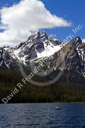 Canoeing on Stanley Lake in the Sawtooth Mountain Range near Stanley, Idaho, USA.