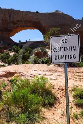 Sign at Wilson Arch,  a natural sandstone arch along U.S. Route 191 near Moab, Utah, USA.