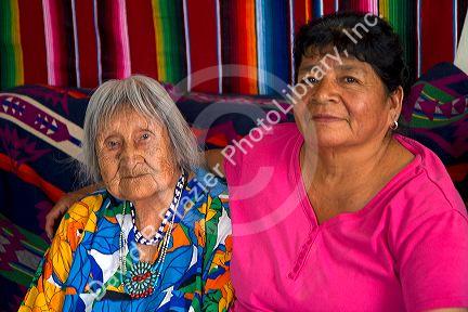 Native Pueblo elderly woman and daughter in San Felipe Pueblo, New Mexico, USA.