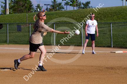 Women playing softball in Denver, Colorado, USA.