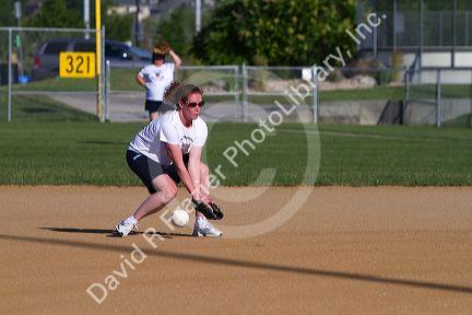 Women playing softball in Denver, Colorado, USA.