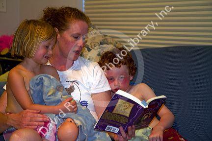 Mother reading to her children. MR