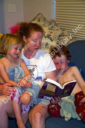 Mother reading to her children. MR