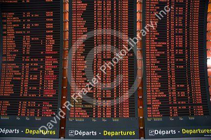 Departure board located in the Paris-Charles de Gaulle Airport, Paris, France.