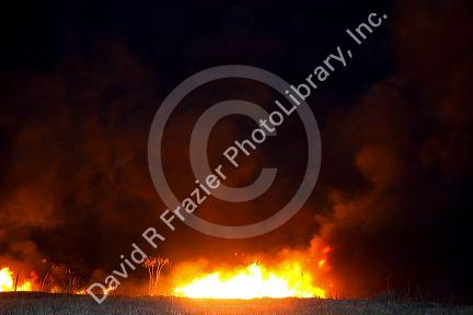 Firefighters work to contain a fire near Federal Way and Kootenai streets in Boise, Idaho, USA. August 21, 2010