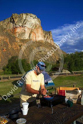 Tent camping and cooking at a campsite along the Salmon River near Salmon, Idaho, USA. MR